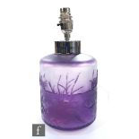 A 20th Century glass table lamp of cylindrical form, cased in amethyst over a paler frosted amethyst