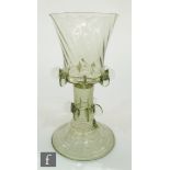 A 20th Century continental green glass goblet in the 17th Century Dutch taste, with wrythen bucket