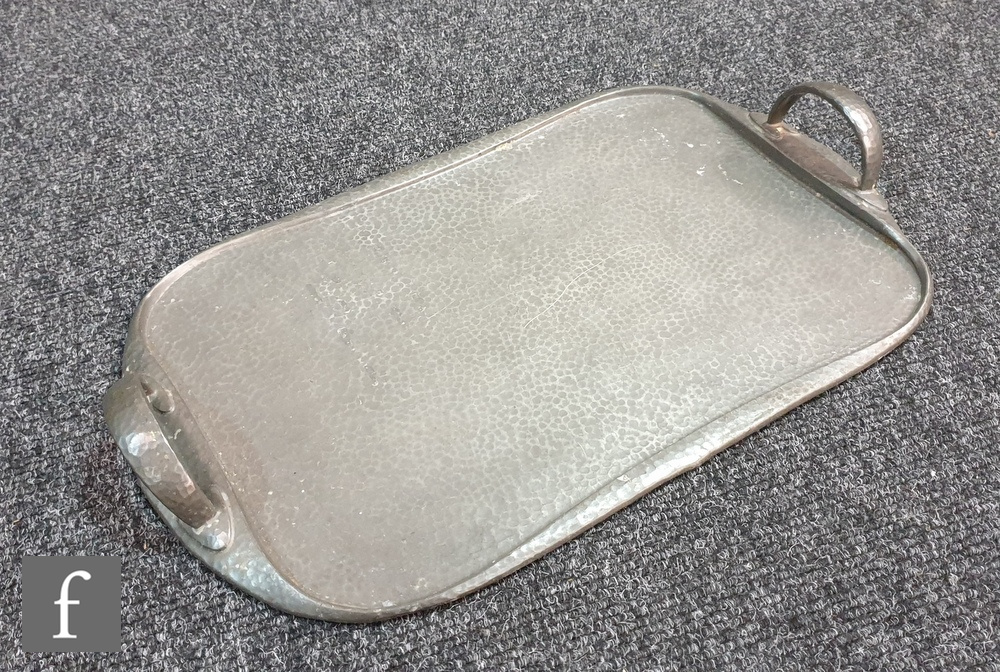 A Liberty & Co. Tudric pewter tray shaped oblong with twin loop handles issuing from shaped leaves