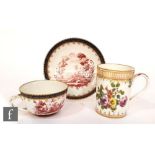A 19th Century tea cup and saucer decorated with an Italianate landscape in pink within blue and