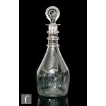 An Irish Cork Waterloo Glass Co. decanter, circa 1800, of mallet form with three applied rings to
