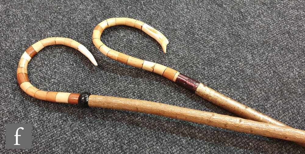 Two 20th Century hand made segmented handle shepherd's crooks, length 128cm. (2)