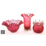 A late 19th Century ruby glass celery vase with clear crystal foot, together with a large frill