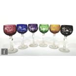 A Harlequin set of six mid 20th Century continental wine glasses with cut and polished decoration