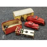 Three Schuco tinplate toys, a Schuco Kommando Anno 2000 in red (lacking key, one wheel detached