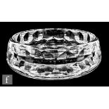 An Orrefors clear crystal bowl, the thick walls cut with a repeat mitre cut circle design,