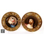 Two late 19th Century hand painted porcelain shallow plates, the first after Guido Reni's Head of