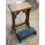 An early 20th Century prayer/reading stand with Gothic carved design and cushioned kneeler, height