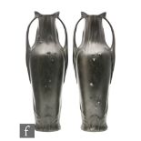 A pair of Kayserzinn Art Nouveau secessionist pewter vases of twin handled shouldered form with