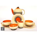 A 1930s Susie Cooper Art Deco tea for two comprising a Kestrel teapot, two teacups, two saucers,