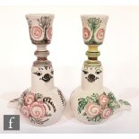 A pair of Bjorn Wiinblad tin glazed candlesticks each modelled as a seated bird with hand painted