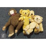 Three Merrythought teddy bears, two golden mohair and a golden plush all with plastic eyes, and a
