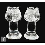 A pair of later 20th Century glass candlesticks formed as stylised tulips upon a tapered column
