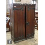 A late 19th Century pitch pine cupboard with castellated cornice and later fitted interior