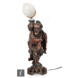 An early 20th Century Japanese rootwood figure of a fisherman converted to a lamp base, heavily