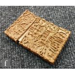 A 19th Century Cantonese carved sandalwood card case worked with figures in garden scenes and a