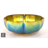 A 1930s WMF Myra Kristal bowl of footed fluted form with a green, gold iridescence, width 15cm.