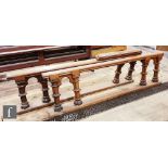 A Victorian oak alter rail with hinged section on castellated style supports and a similar
