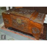 A small carved camphorwood coffer decorated with Chinese characters, on bracket feet, height 41cm