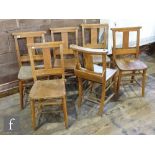A set of six beech church chairs each with prayer or hymn book boxes. (6)