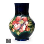 A large Moorcroft vase of globe and shaft form decorated in the Clematis pattern with tubelined