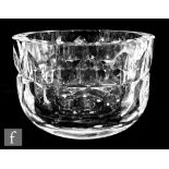 A Kosta clear crystal bowl designed by Goran Warff, the thick walls cut with a repeat stylised