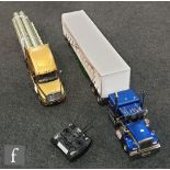 Two 1:14 scale remote control models, the first composed of a Tamiya 56340 Freightliner Cascadia