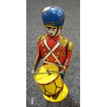 A Wolverine (USA) No. 27 Drum Major tinplate clockwork toy, tinprinted in bright colours, integral