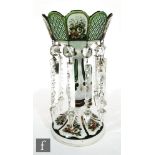 A 19th Century single Bohemian table lustre in the manner of Moser, cased in opal over green and