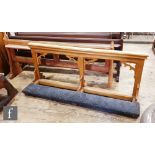 A 20th Century light oak Gothic revival alter rail with kneel cushioned rest, height 78cm x depth