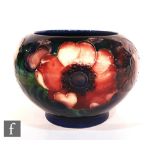A Moorcroft vase of ovoid form decorated in the Anemone pattern, impressed mark, height 8cm.
