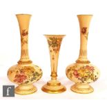 Three late 19th Century Royal Worcester blush ivory vases comprising a pair of shape 1733 bud