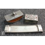 Three pieces of Art Nouveau secessionist pewter to include a desk blotter possibly Kayserzinn,