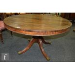 A late Regency period rosewood tilt top breakfast table, on reeded outswept legs, S/D.