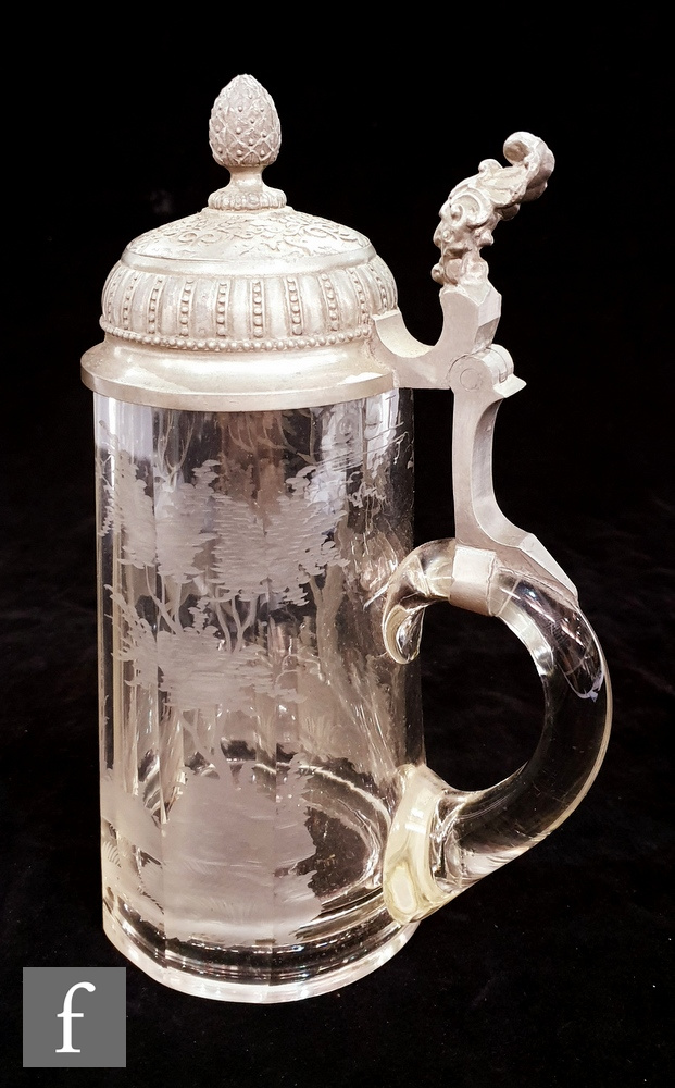 A 19th Century Bohemian clear crystal tankard engraved with a stag running in woodland below a