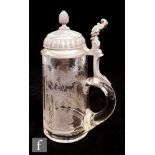 A 19th Century Bohemian clear crystal tankard engraved with a stag running in woodland below a