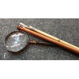 Two military batons, an inlaid wooden baton and a simulated tortoiseshell magnifying glass. (4)