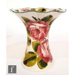 A Wemyss vase of flared form decorated with hand painted roses and foliage, painted mark, height