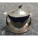 A Kayserzinn Art Nouveau secessionist pewter preserve pot detailed in relief with fruit, with