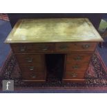 A small 19th Century mahogany kneehole desk fitted with two frieze drawers, one drawer as a pull out