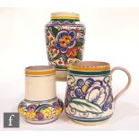 Three pieces of 1930s to 1940s Poole Pottery comprising a V pattern vase, height 23cm, a ZY