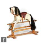 A dapple grey rocking horse in the manner of Collinson, the repainted pine body with replacement