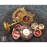 A Reliquary of Sainta Bernadette in 20th Century circular champ leve frame, another in paste oval