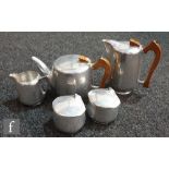 A 1960s Picquot Ware four piece tea set comprising teapot, hot water jug, milk and lidded sugar,