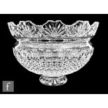 A 20th Century Waterford clear crystal bowl raised to a circular foot, decorated with a band of
