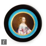 A large framed Sevres circular plaque hand painted with a portrait of Marie-Thérèse d'Autriche (1638