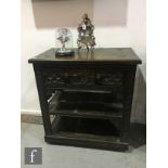 A 17th Century style carved oak two tier buffet, single frieze drawer on block legs united by an