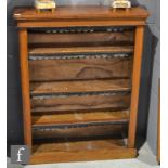 A late Victorian walnut open floorstanding bookcase with adjustable shelves on a plinth base, height