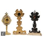 A Reliquary of St Nicoalus Ep.Barien in a 19th Century carved giltwood stand, height 25cm, another