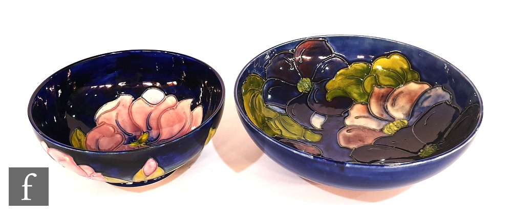 Two Moorcroft footed bowls, the first decorated in the Clematis pattern, the second in the